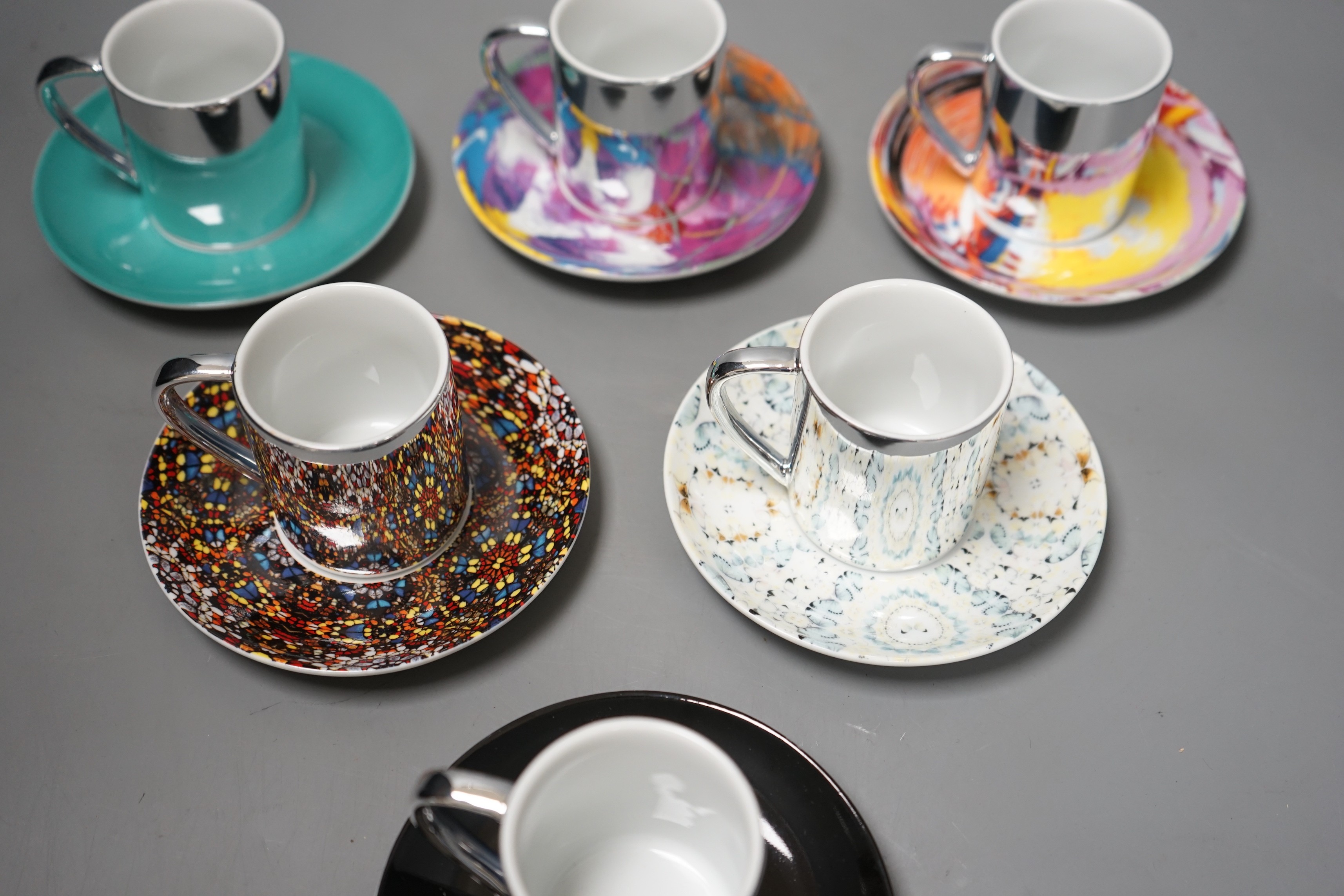 Damian Hirst, a set of six espresso cups and saucers; ‘Doorways to the Kingdom of Heaven’ 2007, ‘For the Love of God’ 2007, ‘The Incomplete Truth’ 2006, ‘Beautiful, cataclysmic pink minty shifting horizon exploding star